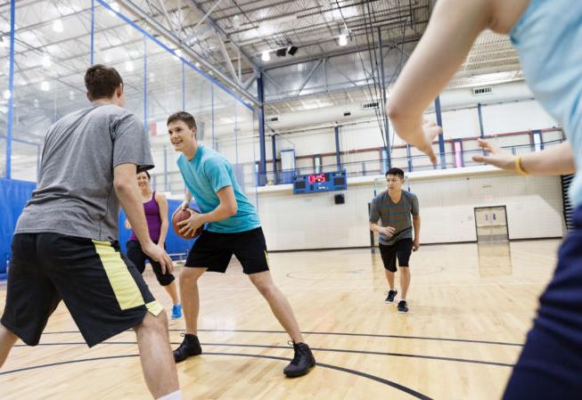 several students play intramural basketball